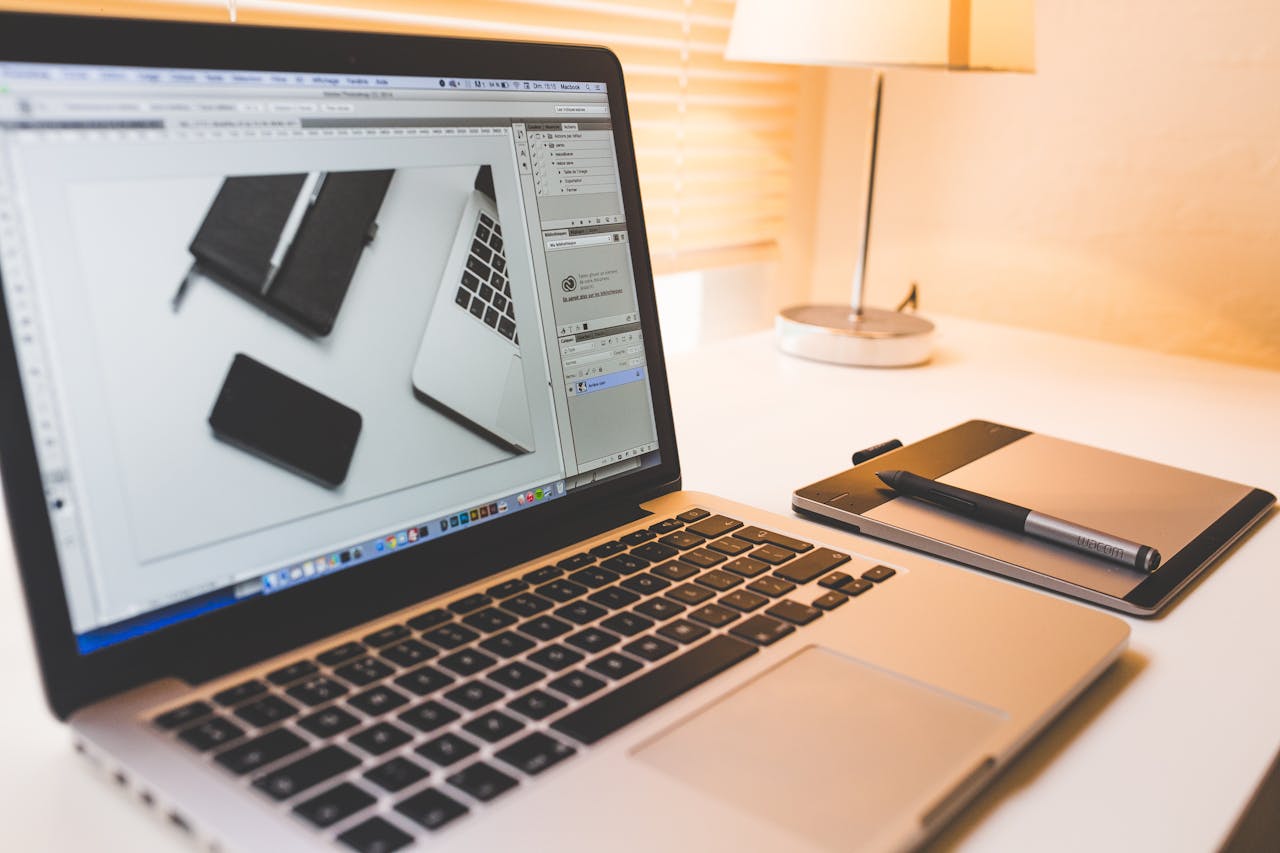 hero-img Modern workspace featuring a laptop, digital pen, and pad for creative work.